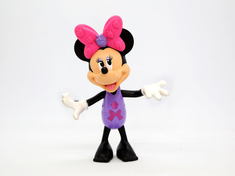 Minni Mouse in a bathing suit or underwear and without shoes. Toy. Cartoon character from Walt Disney Pictures Studios. Minnie is Mickey Mouse's girlfriend. Isolated white. Plastic toys for childrens.