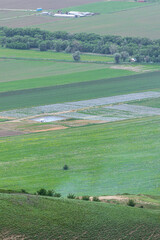 Fototapeta premium Farming fields with irrigation pool