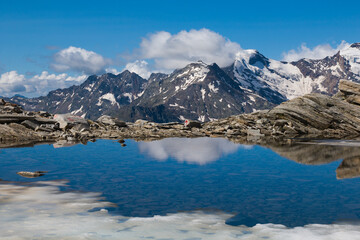 View of Monte Rosa from the pass Monte Moro Pass with beautiful lake Smeraldo - obrazy, fototapety, plakaty