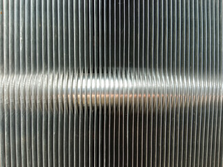 A metal radiator consisting of vertical thin plates and a horizontal tube