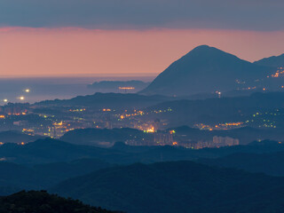 Morning sunrise high angle view of the mountains and cityscape around Wuzhi Shan