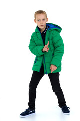 Fototapeta premium Smiling boy in unbuttoned green winter jacket