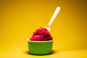 Deep Red Berry Sorbet Yellow Background Green Cup Low Angle