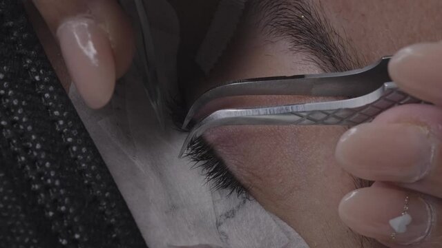 Close up of false eyelash placement on the eye