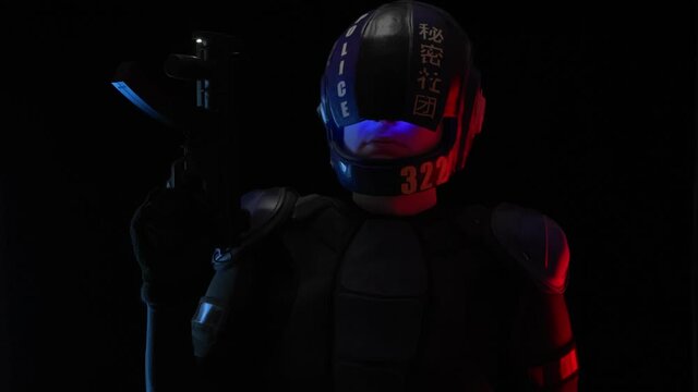 Cyberpunk concept, future world. Police officer cop, halfman bionic cyborg or android holds weapon gun with lantern is in dark. Science fiction scene, fantasy, sci. Portrait. Red blue light. Law Order