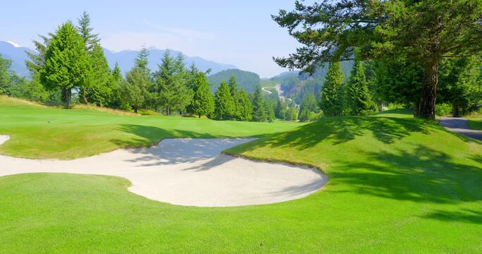 Establishing shot of golf course with gorgeous green and fantastic forest view in Vancouver, Canada, North America. Day time on May 2021. Still camera. ProRes 422 HQ.