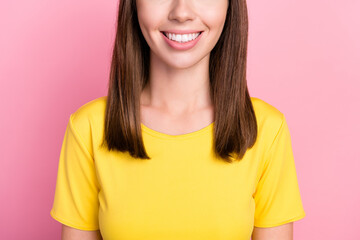 Photo of toothy beaming young woman dressed yellow t-shirt smiling isolated pink color background