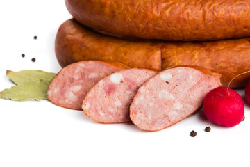 baked smoked sausage with lard on a white plate