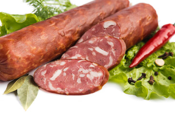 dry-cured salami sausage on a white plate