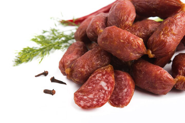 dry-cured salami sausage on a white plate