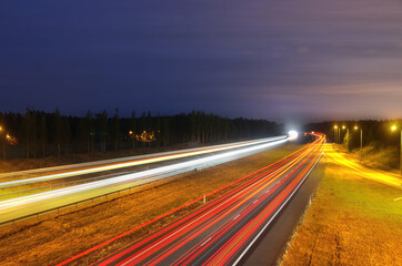 Highway with light trails during night 