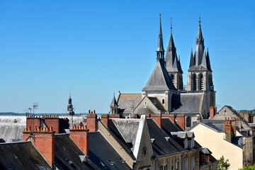 Fototapeta na wymiar Church Saint Nicolas seen from the roofs at Blois, a commune and the capital city of Loir-et-Cher department in Centre-Val de Loire, France,situated on the banks of the lower river Loire
