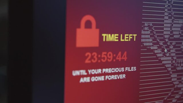 Ransomware running on PC Screen in Closeup all files are encrypted by blackmailing virus showing countdown until all files are gone