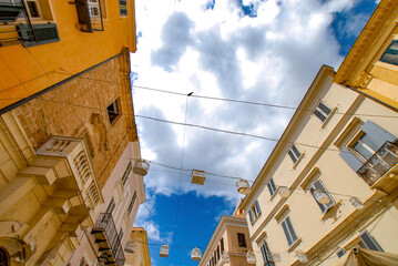 Summer view 2021 of the Alghero old town quarter and its narrow streets and the historic old town...