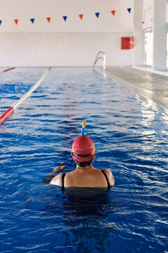 Unrecognizable Senior Woman In Swimming Pool