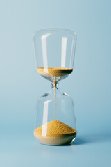 hourglass on a blue background. concept of the passage of time.