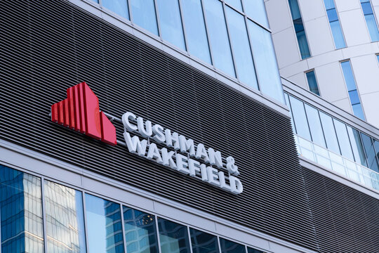 Warsaw, Poland - July 27, 2021: View at Cushman and Wakefield logo on the office facade