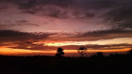 Obraz na płótnie Canvas a red sunset, Sunset, a sunset scene, sunset scenery, Sunset in Jeju Island Korea