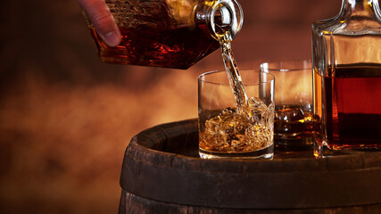 Freeze motion of man hand pouring whisky shot © Jag_cz