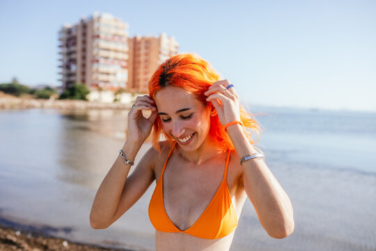 Young cheerful woman at beach
