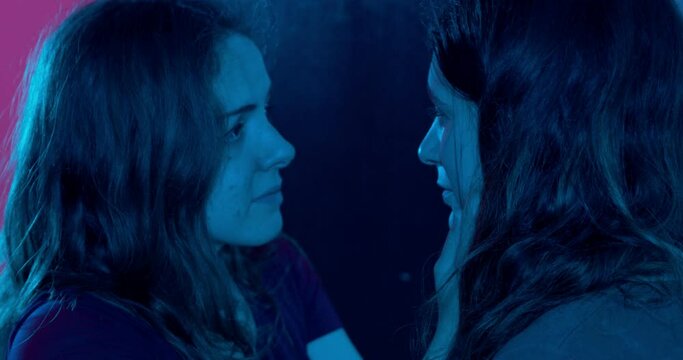 tenderness after a quarrel -young lesbian caresses and hugs her partner