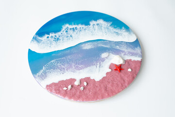 Resin art with waves and beach with starfish. Epoxy paint art