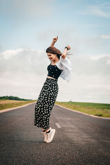 teenager girl dancing on the road. freedom generation z