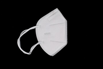 Disposable KN-95 mask or white colored new medical mask. COVID-19 prevention. H1N1, H5N1 safety...