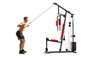 Fototapeta premium Bodybuilder exercising chests on a fitness machine