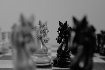 WOODEN CHESS PIECES AND BOARD IN MONOCHROMATIC THEME - obrazy, fototapety, plakaty