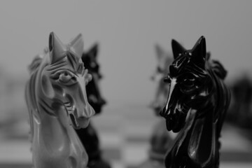 WOODEN CHESS PIECES AND BOARD IN MONOCHROMATIC THEME