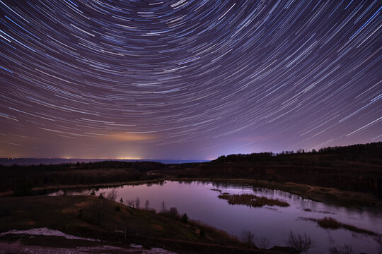 View over an old quarry in the mountain Kinnekulle in Sweden with  some nice star trails