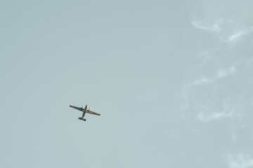 Small aircraft in the sky. Concept of summer vacation travel