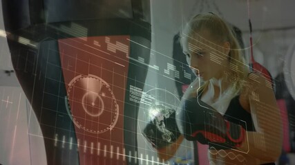 Data processing against caucasian female boxer practicing her punches on punching bag - Powered by Adobe