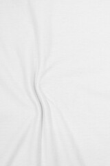 White wavy fabric made of cotton material, wrinkled shape. Fabric background in light tone.
