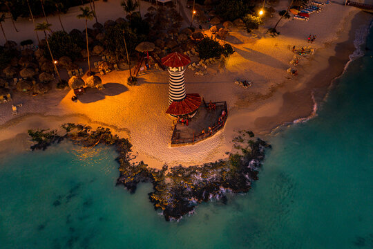 Aerial view of people on Dominicus Beach as night falls