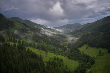 Fototapeta na wymiar View of the Carpathians in the evening fog