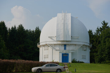 White Radio Telescope, a large satellite dish on a background of blue sky, radar. Technology concept, search for extraterrestrial life, wiretap of space. Mixed medium, copy space