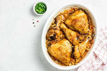 Roasted garlic butter lemon chicken and cabbage in baking dish. Space for text, top view.