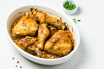 Oven roasted chicken with cabbage in baking dish. Space for text.