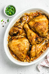 Roast chicken and vegetables in baking dish. Space for text, top view.