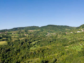 Fototapeta na wymiar Panoramic hilly landscape of Lower Srebrenik settlement with forests and meadows