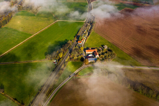 Panoramic aerial view of an autumn landscape with fog, Germany.