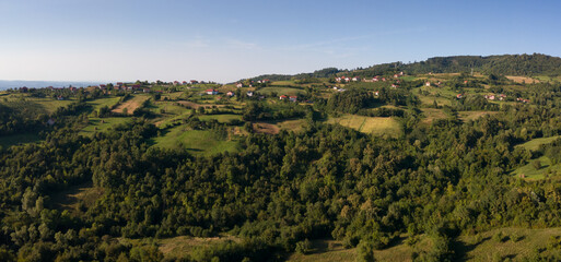 Panoramic hilly landscape of Lower Srebrenik settlement with forests and meadows