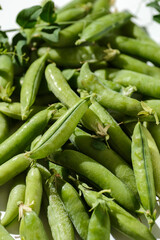Fototapeta premium green peas and pods on a white background