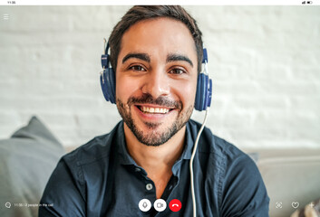 Young businessman on a work video call while staying at home.