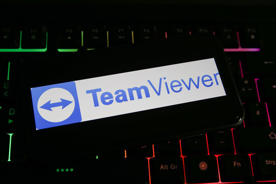 Viersen, Germany - June 1. 2021: Closeup of mobile phone screen with logo lettering of teamviewer on computer keyboard