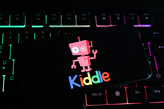 Viersen, Germany - June 1. 2021: Closeup of mobile phone screen with logo lettering of kiddle search engine on computer keyboard
