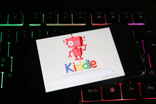 Viersen, Germany - June 1. 2021: Closeup of mobile phone screen with logo lettering of kiddle search engine on computer keyboard