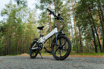 Eco friendly mode of transport. A bicycle with an electric motor. An electric bike of white color...